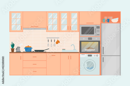 Cozy kitchen interior in peach shades, flat vector illustration. Refrigerator, oven, microwave, washing machine, flowerpot, dishes.