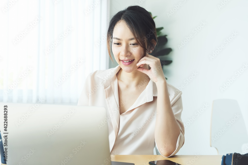 new normal, a businesswoman using computer to work for a company Via the internet on your desk at home. new normal, a businesswoman using computer to work for a company Via the internet on your desk at home.
