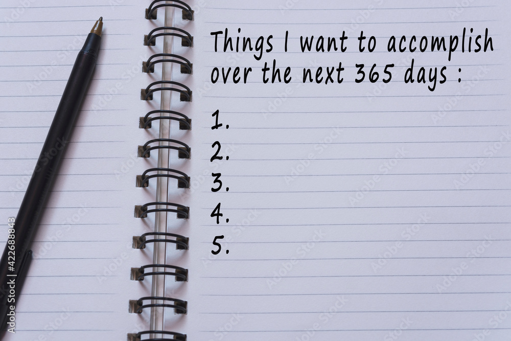 Text on notepad - Things I want to accomplish over the next 365 days Text on notepad - Things I want to accomplish over the next 365 days