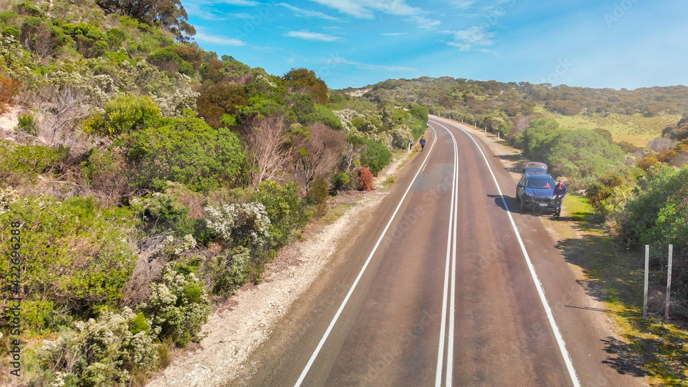 KANGAROO ISLAND, AUSTRALIA - SEPTEMBER 2018: Tourists along an island road on a sunny day KANGAROO ISLAND, AUSTRALIA - SEPTEMBER 2018: Tourists along an island road on a sunny day
