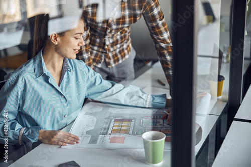 Two designers working at a new building plan