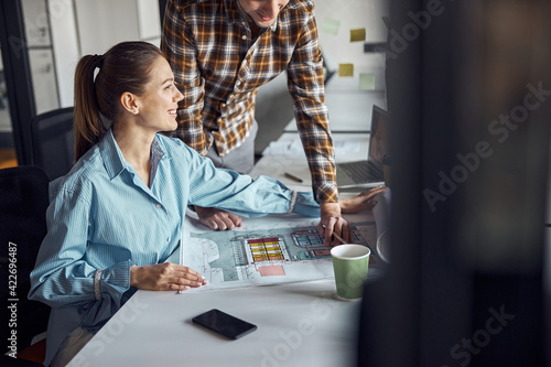 Two designers working at a new technical drawing photo