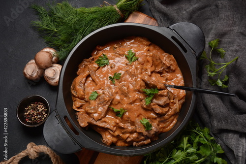 Beef Stroganoff with cremini and champignons on a frying pan.