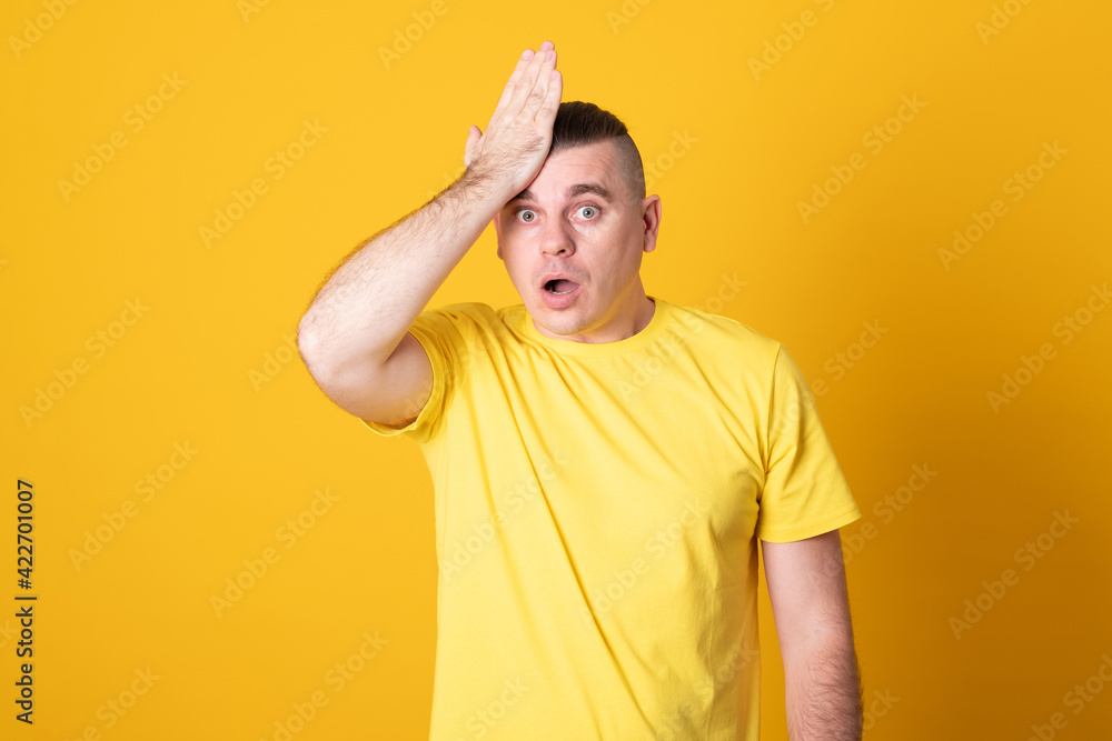 Young handsome man over isolated background surprised with hand on head for mistake, remember error. Forgot, bad memory concept. Young handsome man over isolated background surprised with hand on head for mistake, remember error. Forgot, bad memory concept.