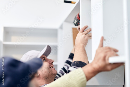 Εκτύπωση καμβά Handyman worker fixing and assembling household furniture.