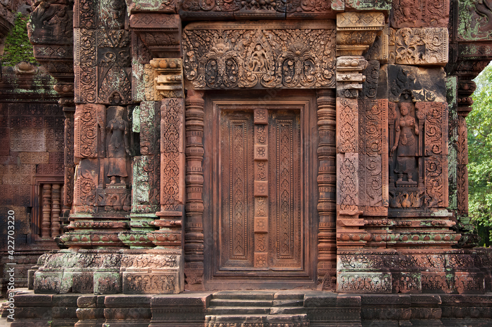 Decorative door stone carving at Banteay Srei (Banteay Srey) ancient temple made of pink sandstone dedicated to the Hindu god Shiva, Angkor Wat, Khmer culture, Siem Reap, Cambodia