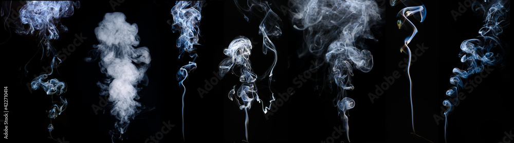 Фотография Cigarette smoke on dark background