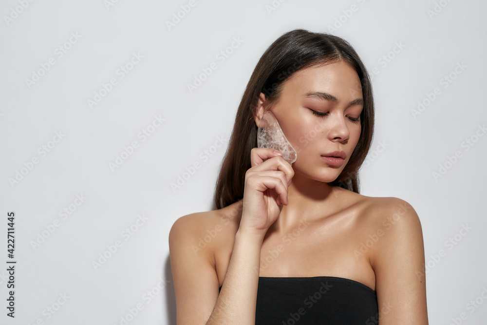Young girl with makeup stands in the studio Young girl with makeup stands in the studio