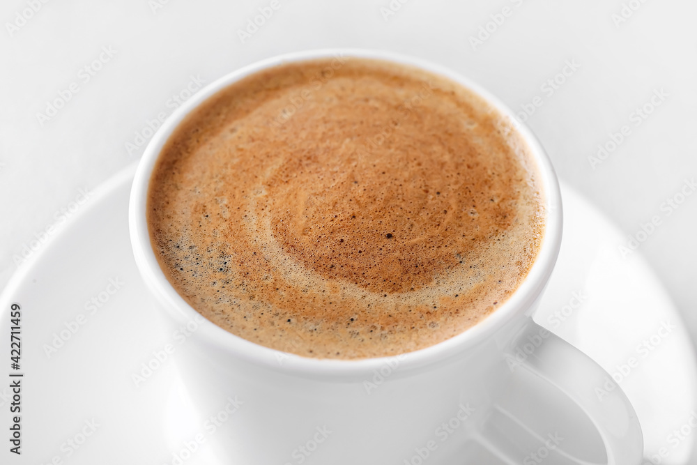 Cup of tasty hot coffee, closeup