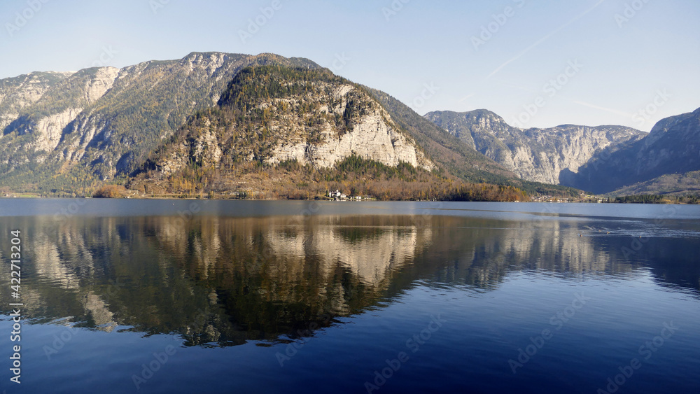 Lake Hallstatt in Austria with reflections of the mountains- Alpine view.