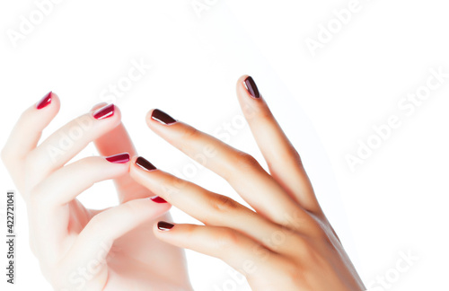 two different nathion manicured hands on white isolated  african with caucasian