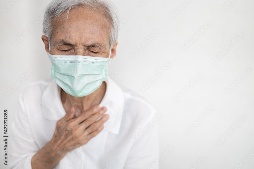 Sick asian senior woman having difficulty breathing,patient suffering from pain in chest feel tight,acute dyspnea,asthma,shortness of breath,problems of heart attack,chronic health congenital disease