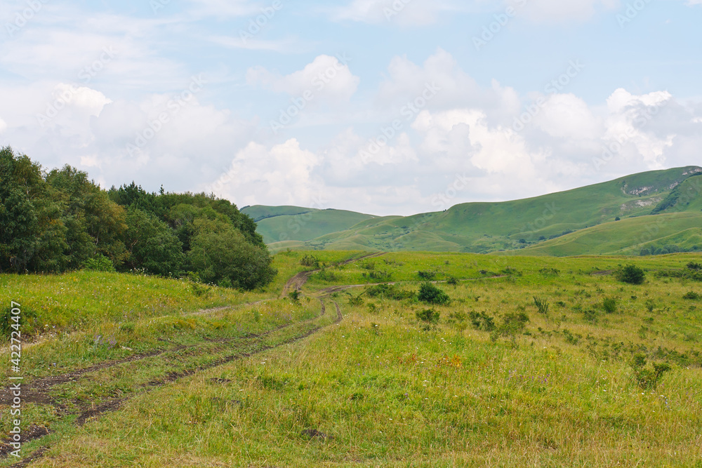 Beautiful landscape with meadows and forests in foothills of North Caucasus. Beautiful landscape with meadows and forests in foothills of North Caucasus.
