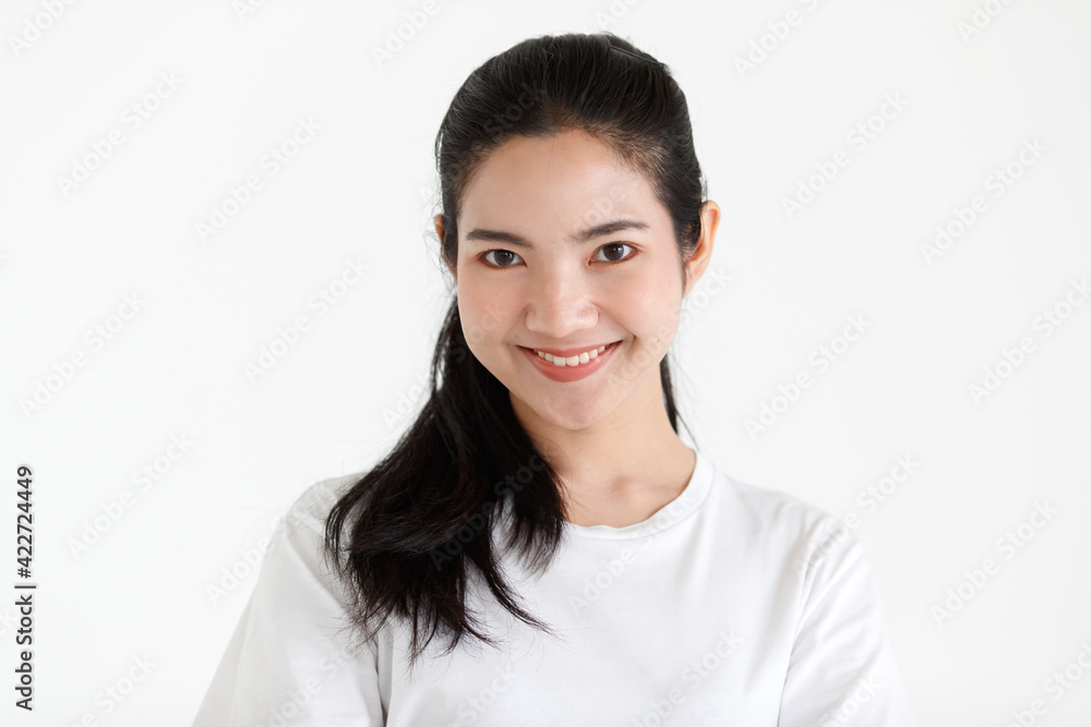 Portrait of a young teen Asian woman with a black long hair on white background Portrait of a young teen Asian woman with a black long hair on white background