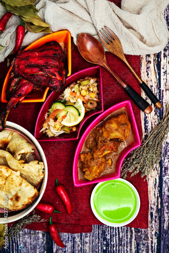 Traditional Indian food chicken tandoori and Tikka with garlic naan