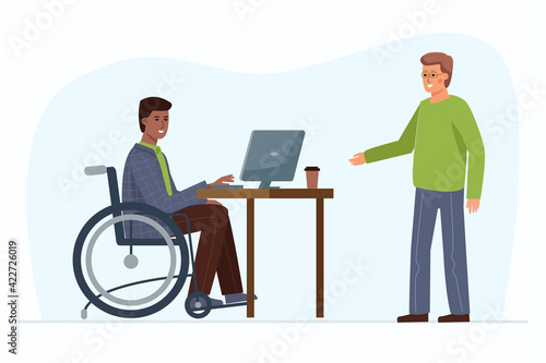 A man in a wheelchair, working in an office at a computer, communicating with a colleague. Employment for the disabled.