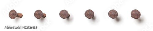 Foto Rusty nail from different perspectives on a white background