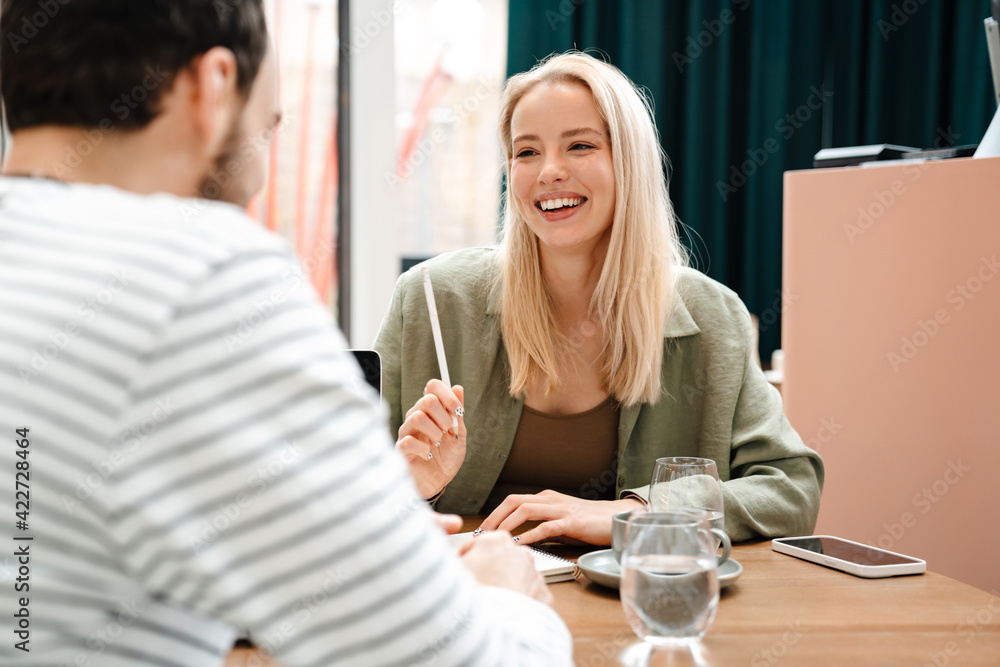 Two young man and woman having a discussion Two young man and woman having a discussion