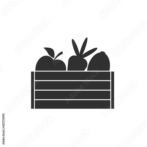 Silhouettes ripe fruits and vegetables in a wooden crate. Harvest icon. Apple, carrot and lemon in a wooden box. Black and white vector. Isolated illustration on white blank background.
