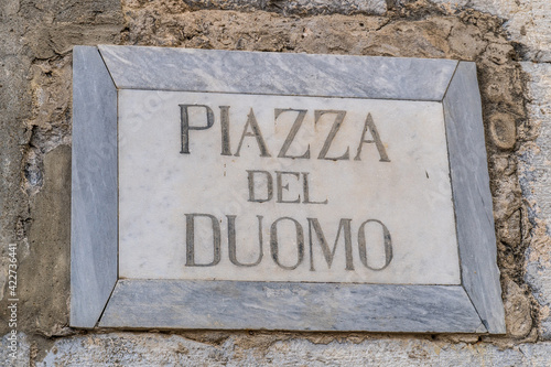 Piazza del Duomo square name sign in the center of Cefalù, Sicily, Italy