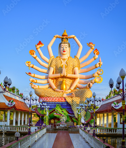 Wat Plai Laem temple the giant Guanyin has 18 hands. statue which is a beautiful towering white structure at Koh Samui in Surat Thani, Thailand.