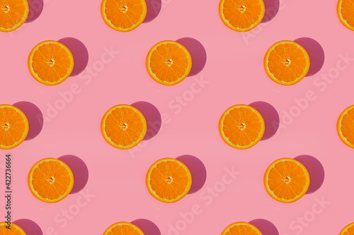 Fototapeta Naklejka Na Ścianę i Meble -  Pattern of oranges on pink background