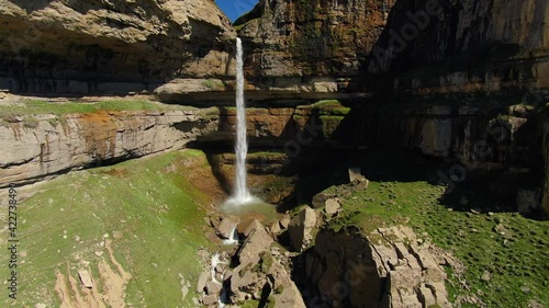 Tobot Waterfall Dagestan Khunzakh region beautiful waterfall falls a stream from cliff into deep gorge, ancient cinematic rocks. Wild natural landscape, highest north Caucasus cascade. Russia. Aerial photo