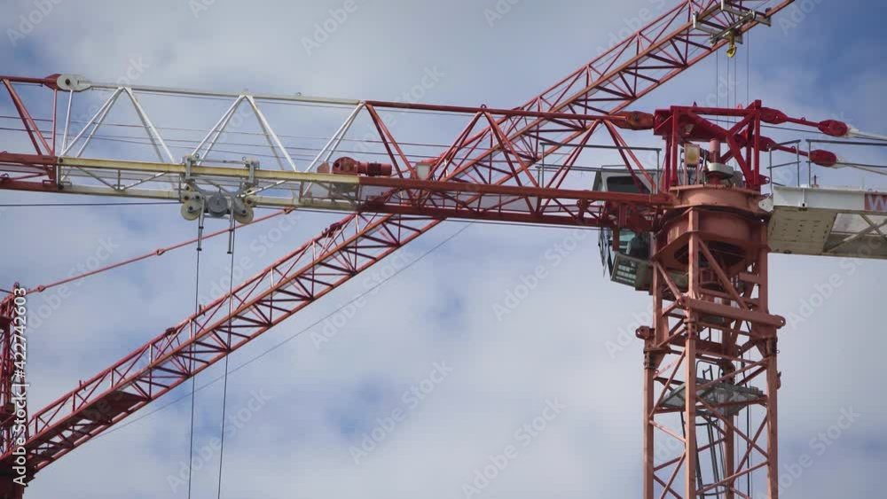 Tower crane working on the construction site Tower crane working on the construction site
