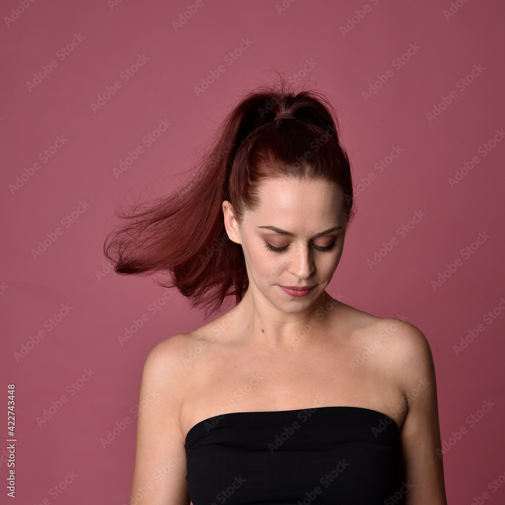 close up portrait of red haired women with different facial expressions on a pink studio background. close up portrait of red haired women with different facial expressions on a pink studio background.