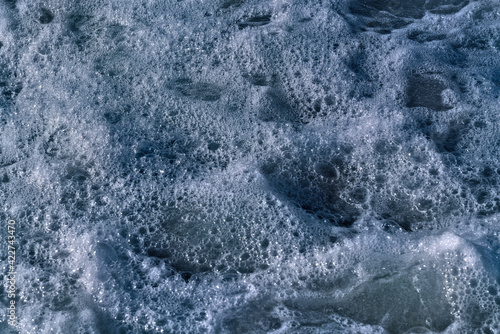 White foam on the sea as an abstract background