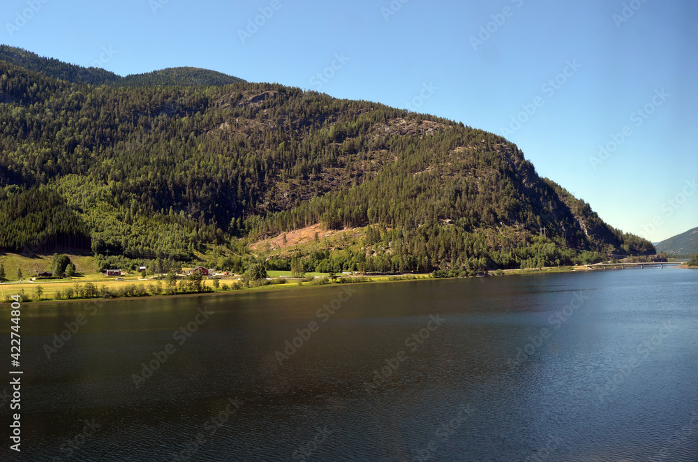 Views from the train window. Mountain tundra of Central Norway. Railway travel in Norway.The Bergen - Oslo train. Views from the train window. Mountain tundra of Central Norway. Railway travel in Norway.The Bergen - Oslo train.