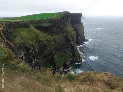 View of the Cliffs of Moher in summer. Cliff in Ireland, on the Atlantic Ocean in County Clare.
