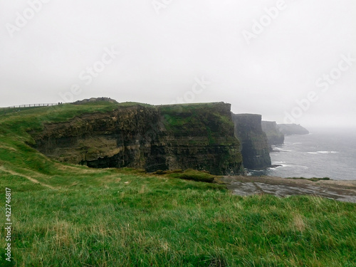 View of the Cliffs of Moher in summer. Cliff in Ireland, on the Atlantic Ocean in County Clare.