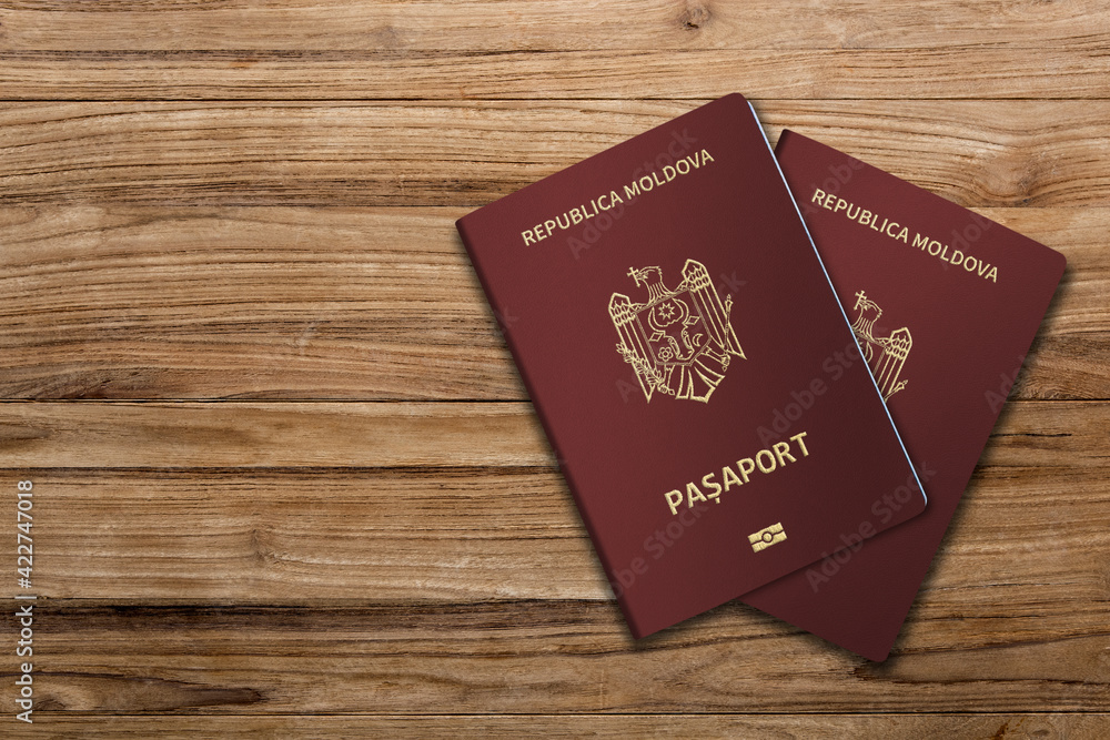 ldovan passports are issued to citizens of the Republic of Moldova for the purpose of international travel, Moldovan passport on a wooden floor
ldovan passports are issued to citizens of the Republic of Moldova for the purpose of international travel, Moldovan passport on a wooden floor