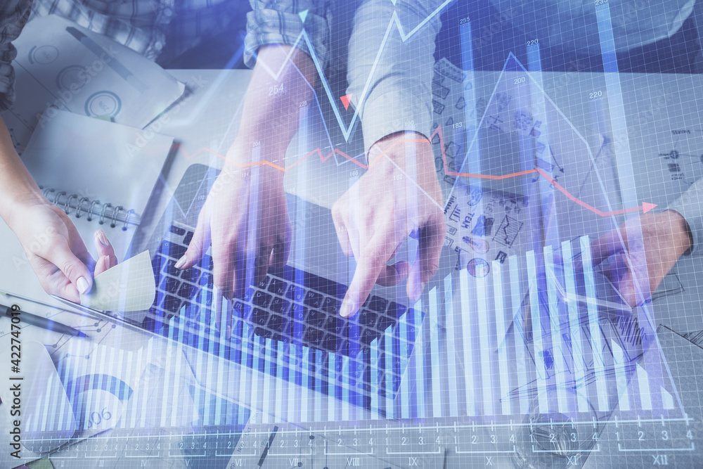Double exposure of man and woman working together and forex graph hologram drawing. Financial analysis concept. Computer background. Top View. Double exposure of man and woman working together and forex graph hologram drawing. Financial analysis concept. Computer background. Top View.