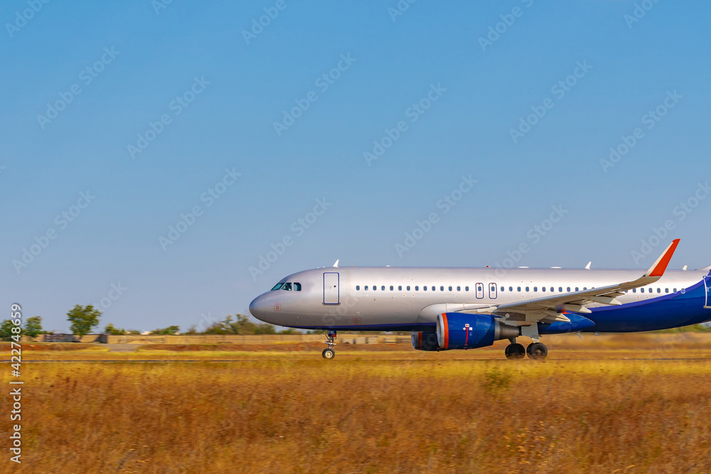 Big passenger airplane drives along the runway in airport Big passenger airplane drives along the runway in airport