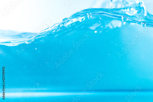 Fototapeta Naklejka Na Ścianę i Meble -  Water wave with bubble of air, on white background. Blue water