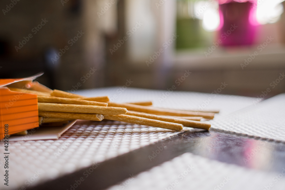 Fototapeta premium long crispy straws on the kitchen table