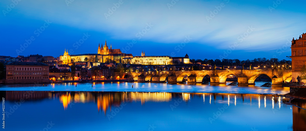 View of Charles Bridge Karluv most and Prague Castle Prazsky hrad in twilight. Panorama
