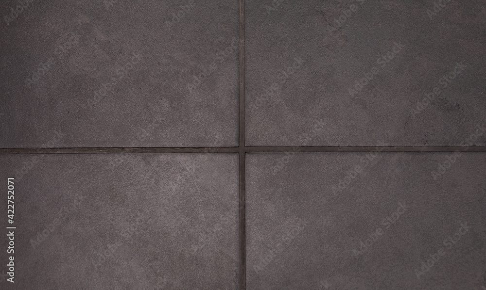 Fototapeta premium Background texture of textured square floor ceramic tiles