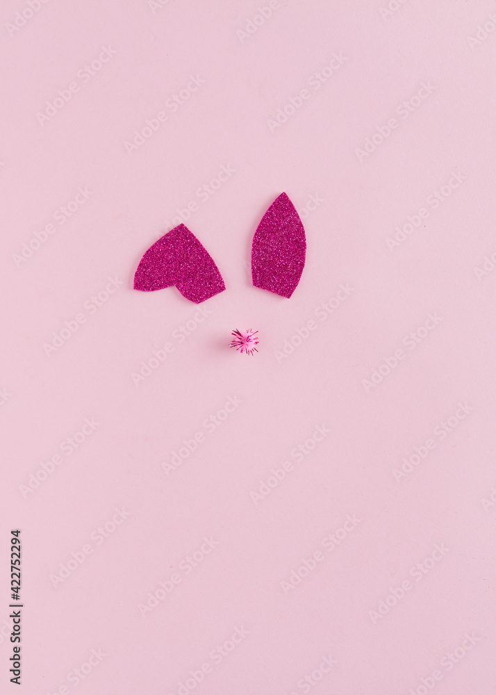 Bunny glitter rabbit ears and nose on pastel pink background. Happy Easter minimal concept. Flat lay. Bunny glitter rabbit ears and nose on pastel pink background. Happy Easter minimal concept. Flat lay.