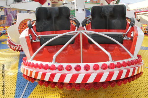 The Seats of a Fast Spinning Fun Fair Amusement Ride. photo