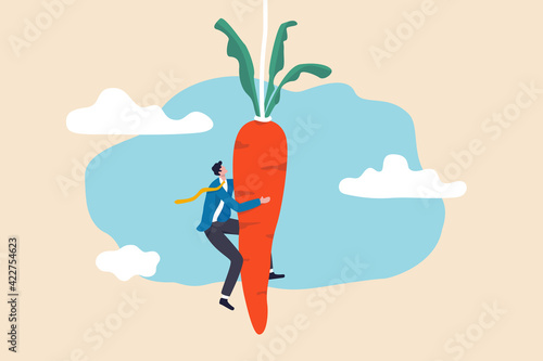 Motivation and incentive to motivate employee, reward or trick to influence people or manipulation concept, seduced businessman jump in the air to catch tempting carrot baiting lure from the stick.