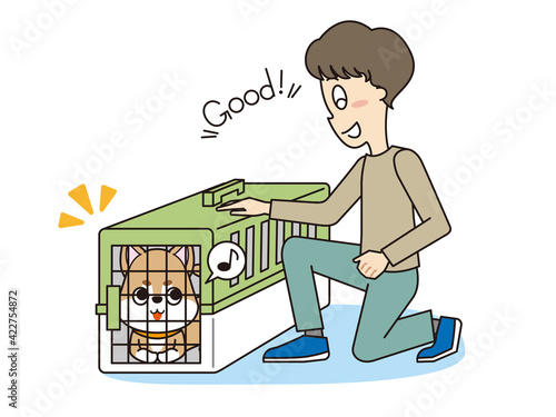 トレーナーのしつけを聞いてクレート（ハウス）に入った柴犬