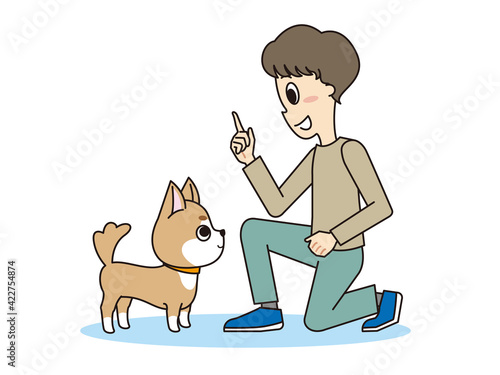 トレーナーのしつけを聞く柴犬
