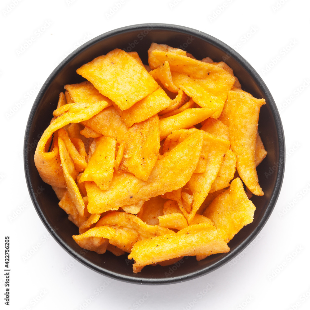 Close up of Soya Chips crunchy and salty Indian Namkeen on a ceramic white bowl. Top view Close up of Soya Chips crunchy and salty Indian Namkeen on a ceramic white bowl. Top view