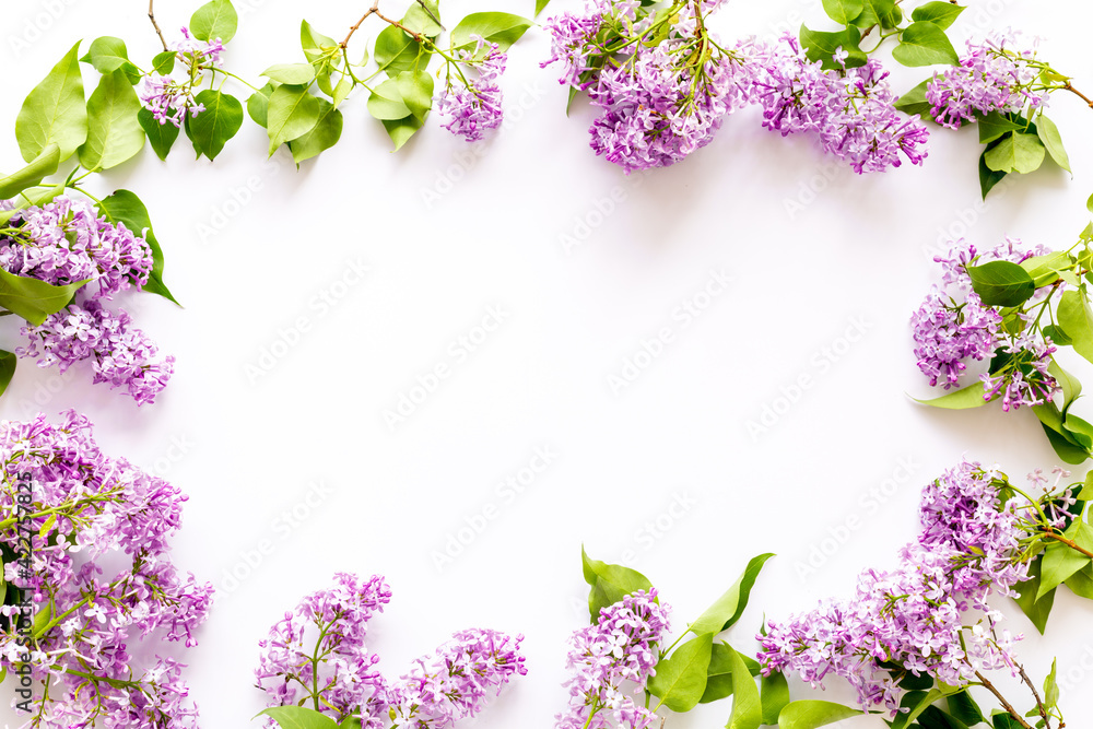 Border of spring lilac flowers. Flat lay, top view