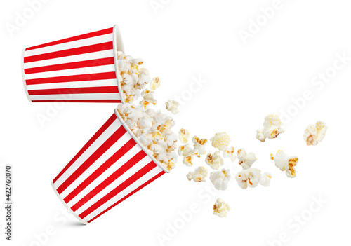 Two falling popcorn paper cups, isolated on white background