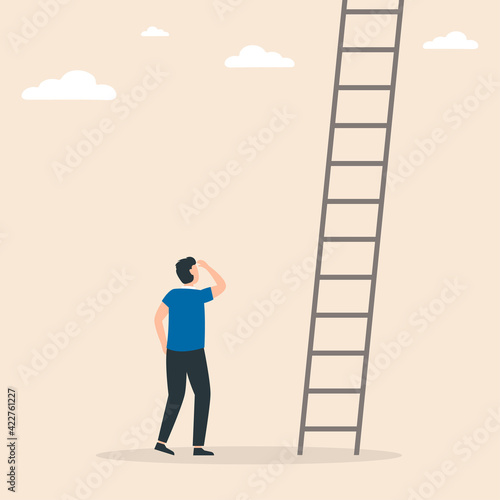 Businessman stands in front of ladders. Conquer new heights. Business concept of career development, growth, opportunity.