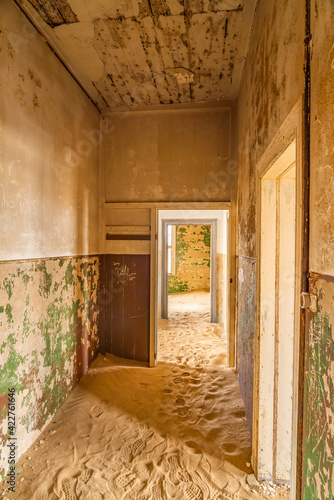 View of a corridor at German Kolmanskop Ghost Town with the abandoned buildings in the Namib desert